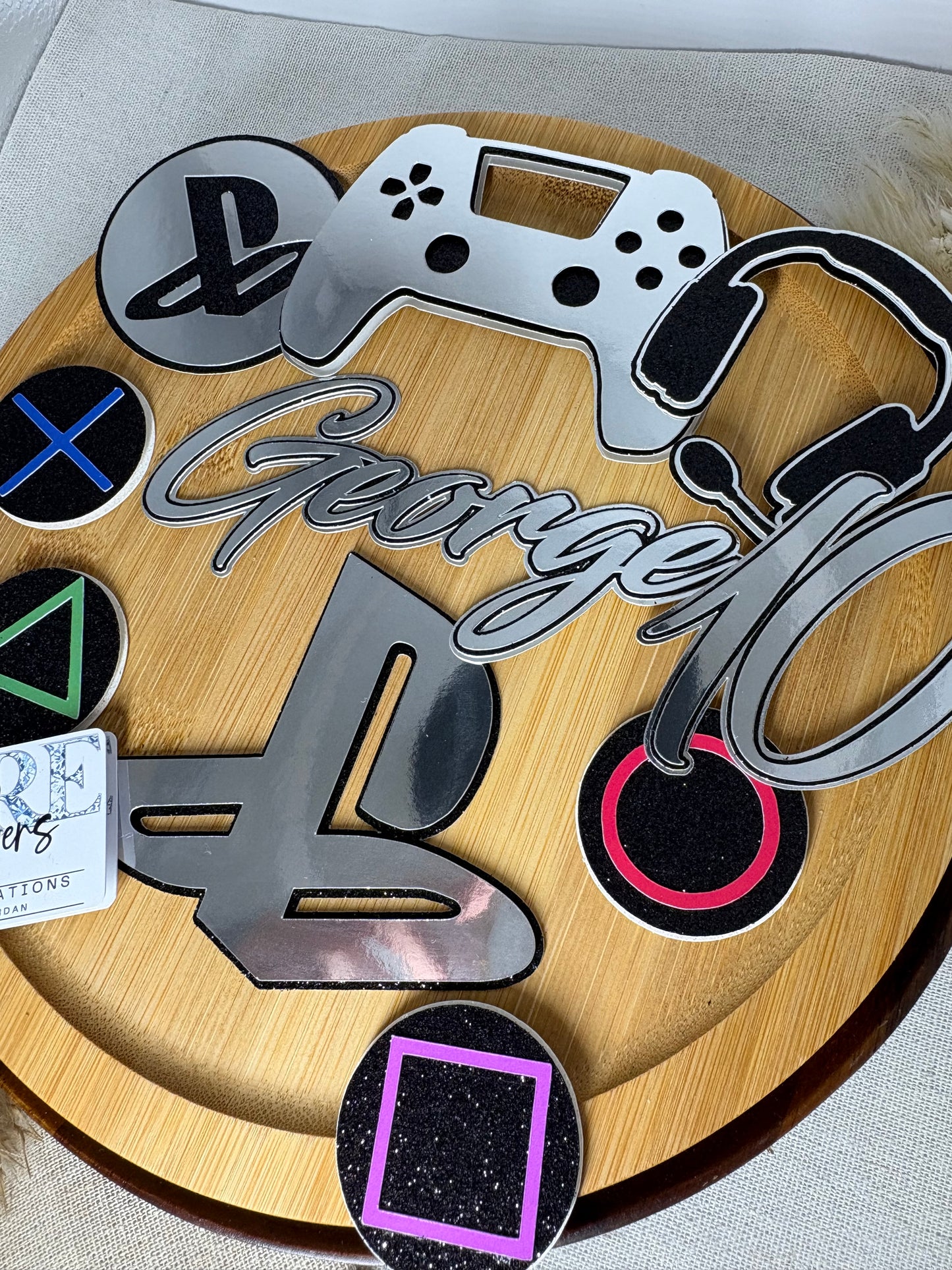 Decorative keychain set with gaming symbols on a wooden board