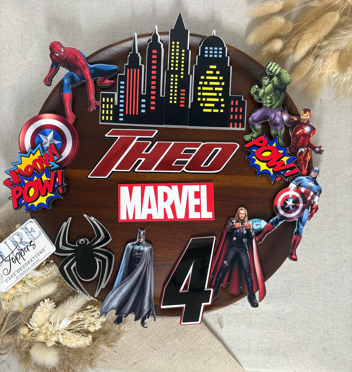 Personalised Marvel superhero cake topper set with custom name, age, city skyline and Avengers-inspired birthday cake decorations.