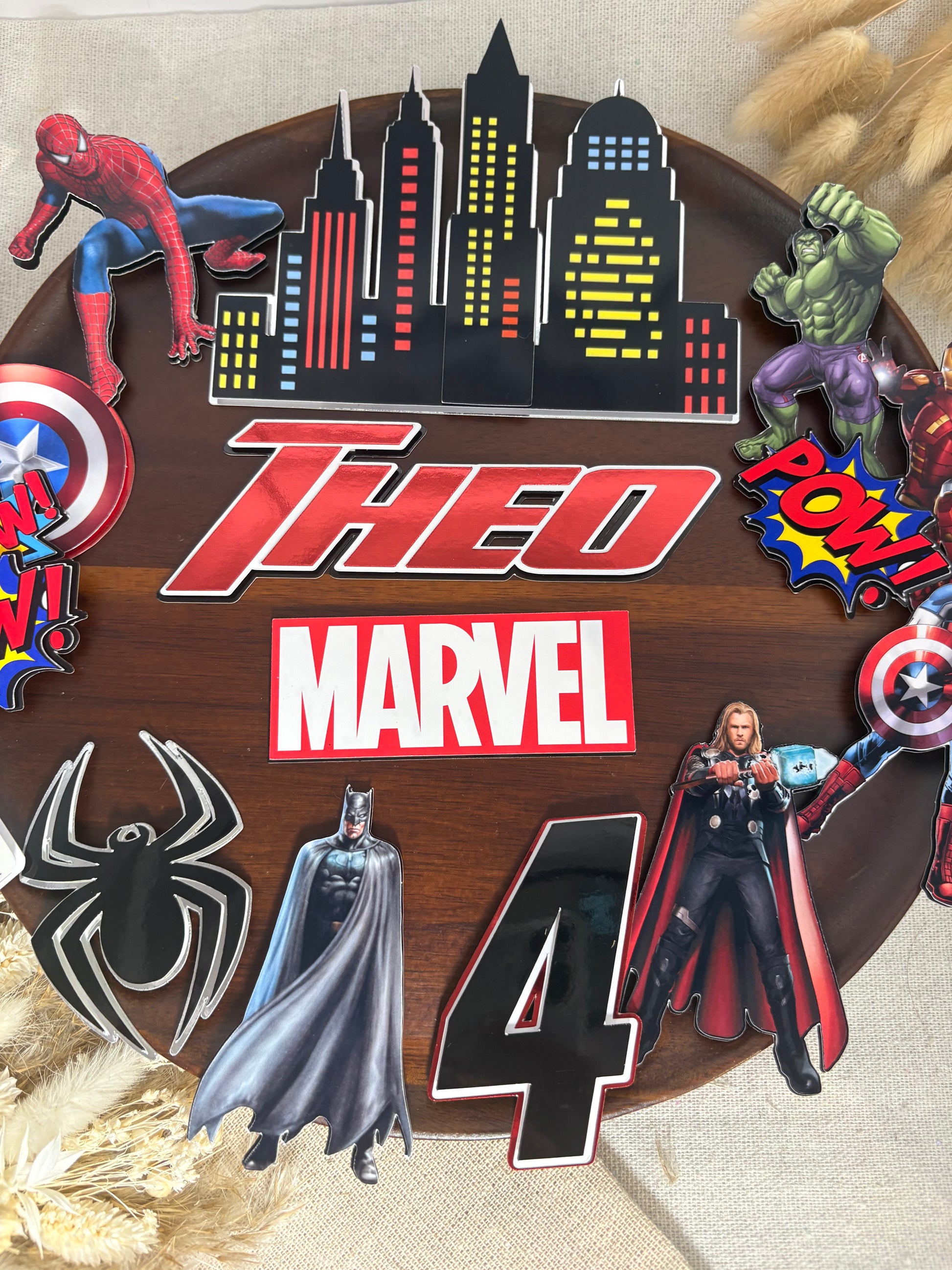 Personalised Marvel superhero cake topper set with custom name, age, city skyline and Avengers-inspired birthday cake decorations.