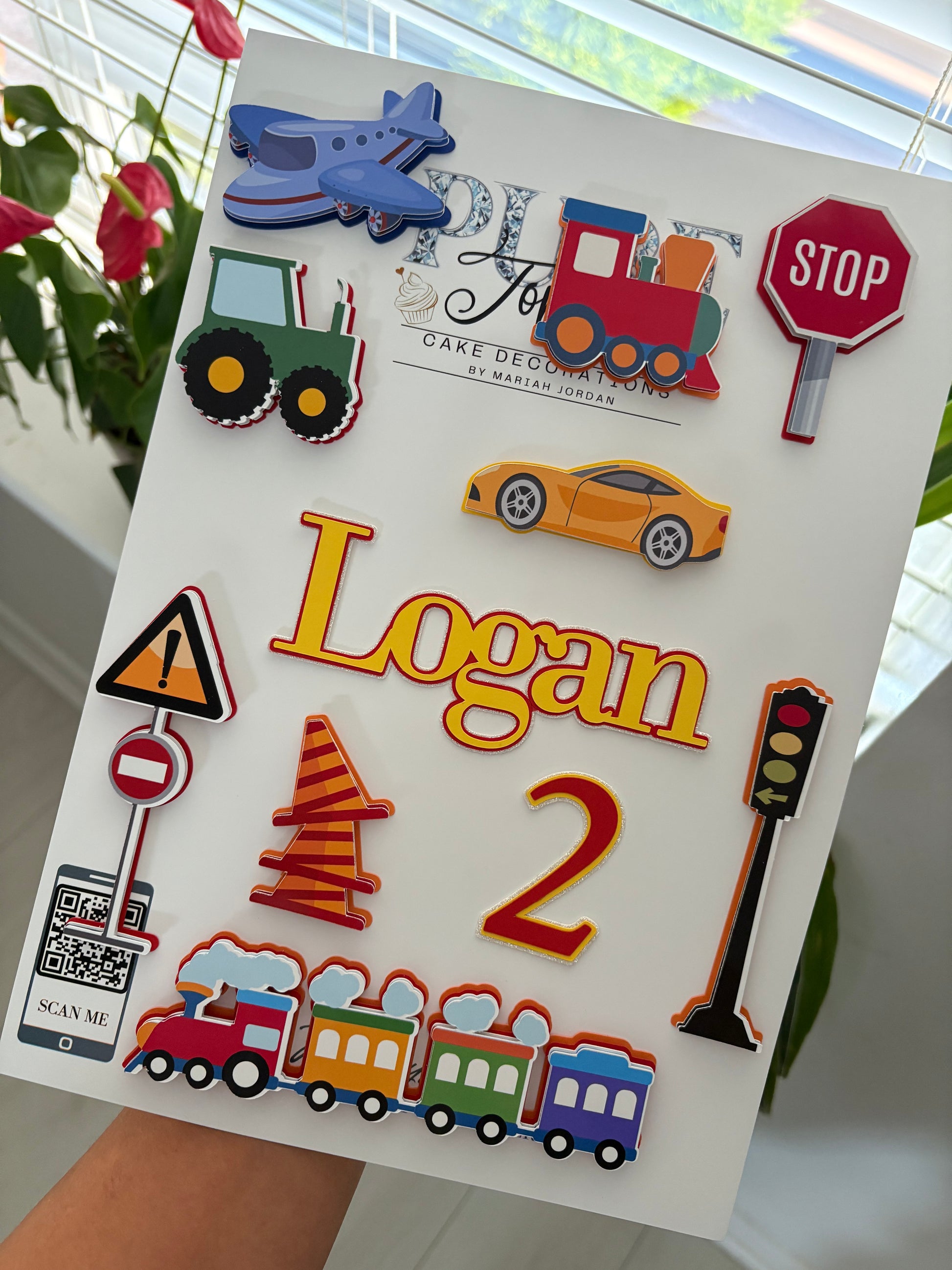 Personalised kids transport cake topper set featuring layered cars, trains, planes, and tractors with custom name and age charms – handmade birthday decoration by Pure Toppers