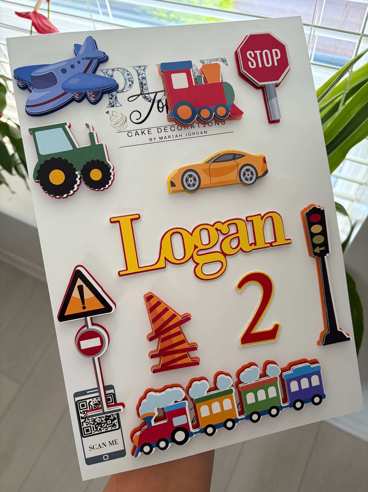 Personalised kids transport cake topper set featuring layered cars, trains, planes, and tractors with custom name and age charms – handmade birthday decoration by Pure Toppers
