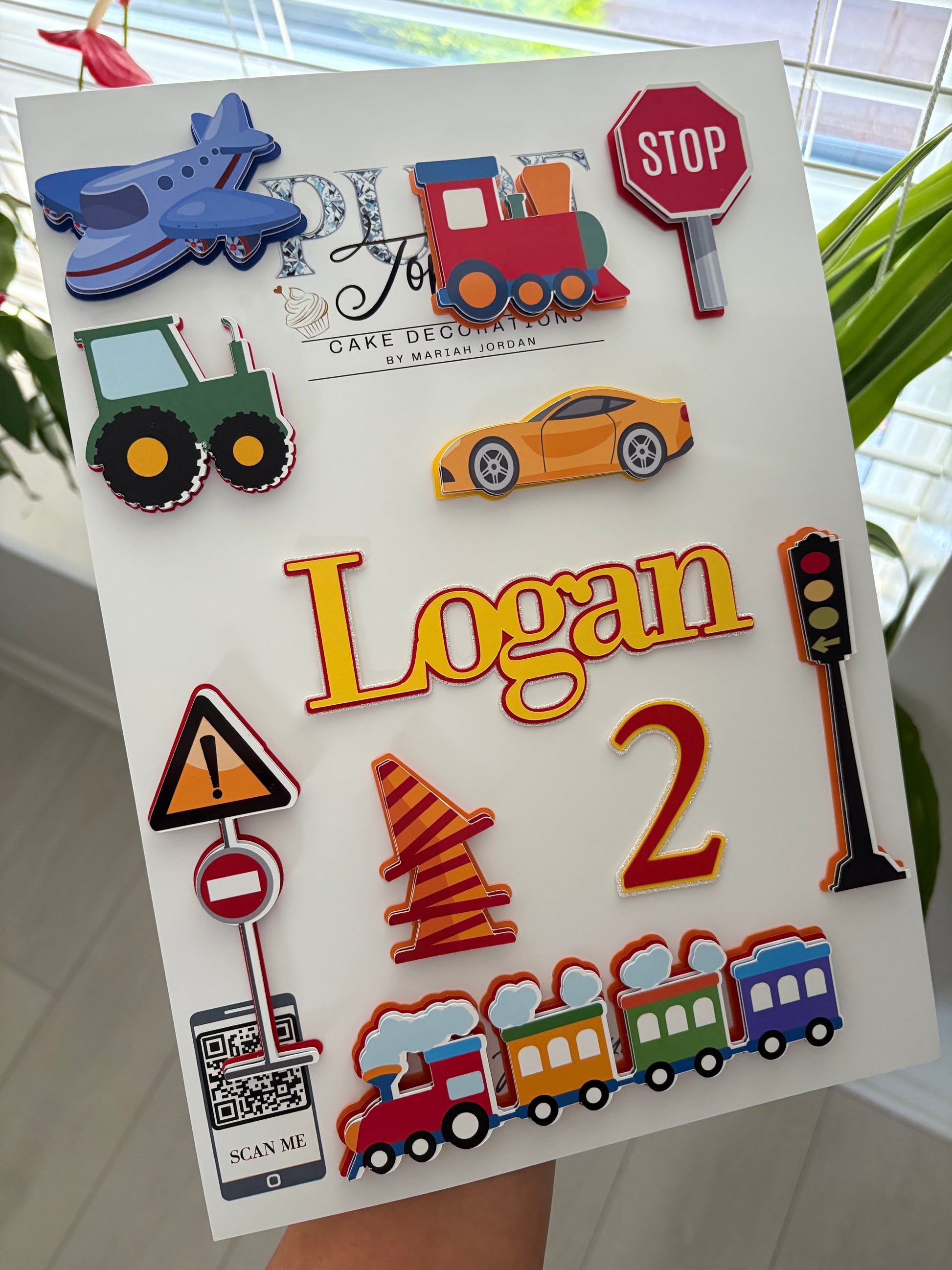 Personalised kids transport cake topper set featuring layered cars, trains, planes, and tractors with custom name and age charms – handmade birthday decoration by Pure Toppers