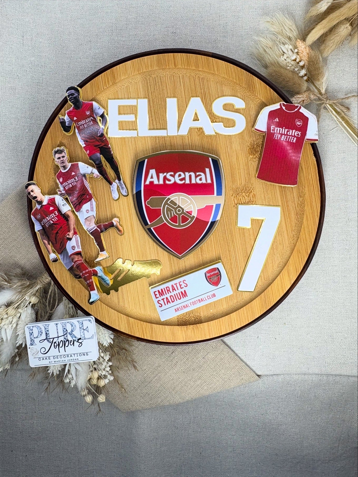 Personalised Arsenal football cake topper with custom name and age on birthday cake
