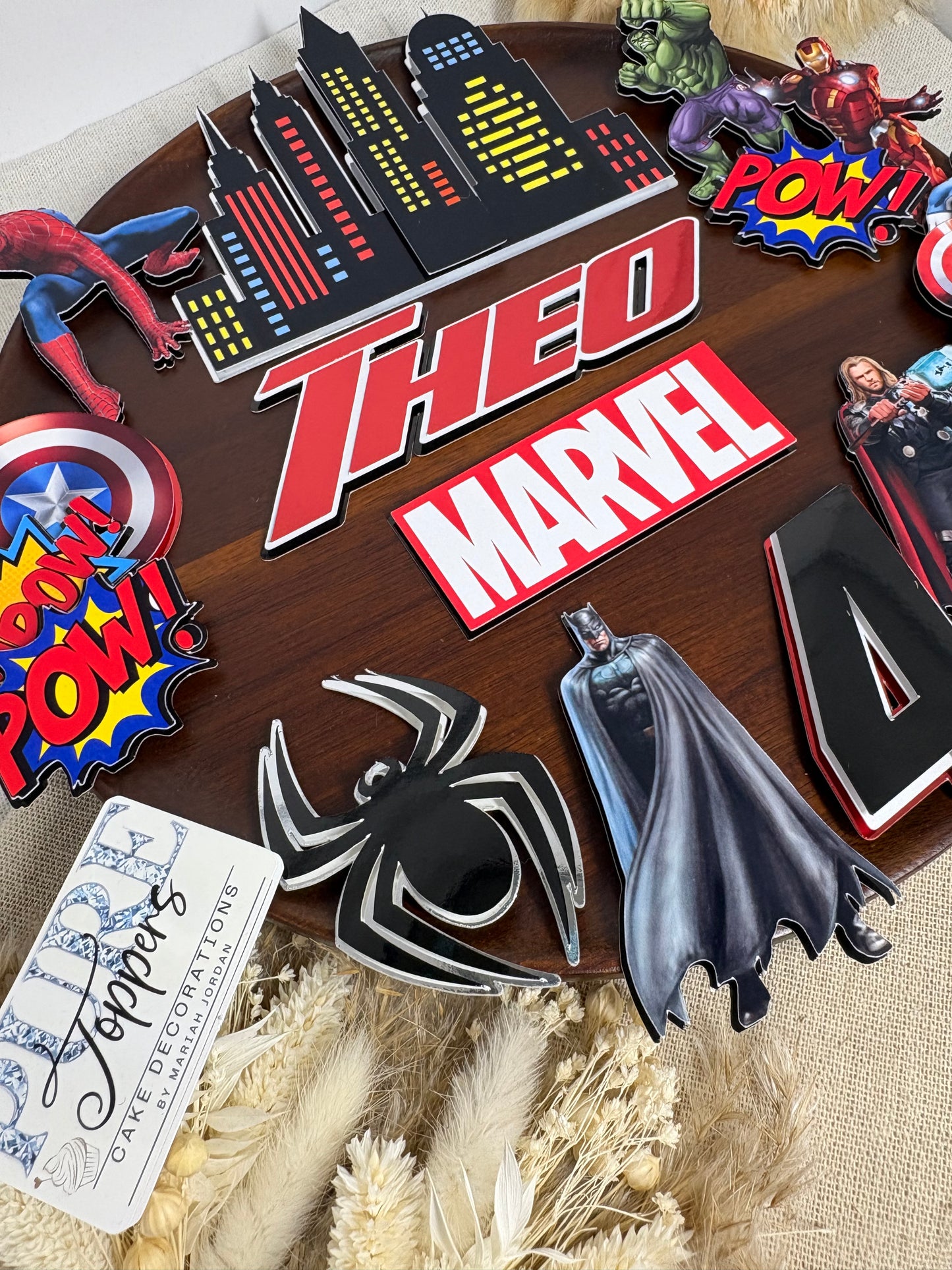Personalised Marvel superhero cake topper set with custom name, age, city skyline and Avengers-inspired birthday cake decorations.