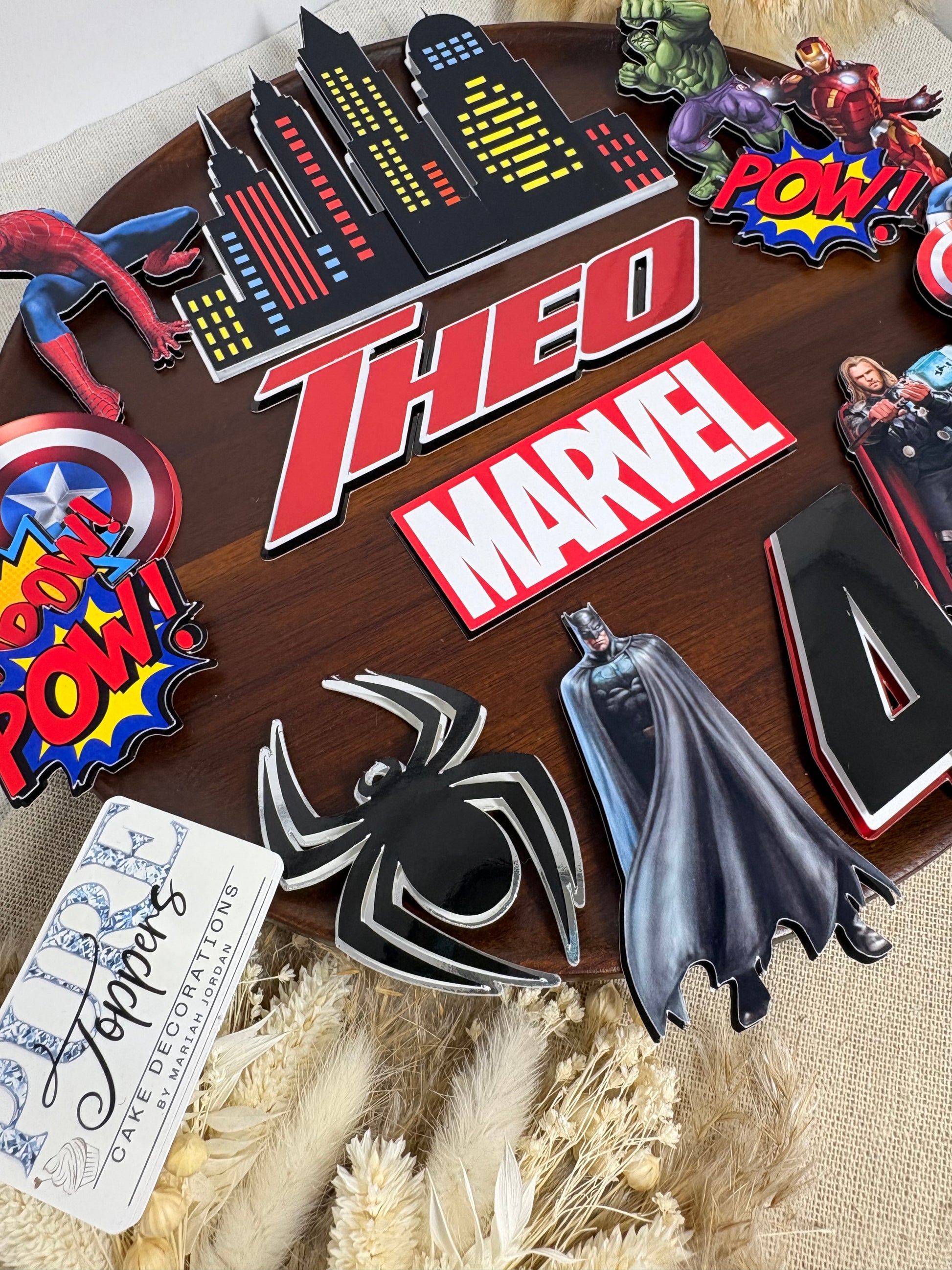 Personalised Marvel superhero cake topper set with custom name, age, city skyline and Avengers-inspired birthday cake decorations.