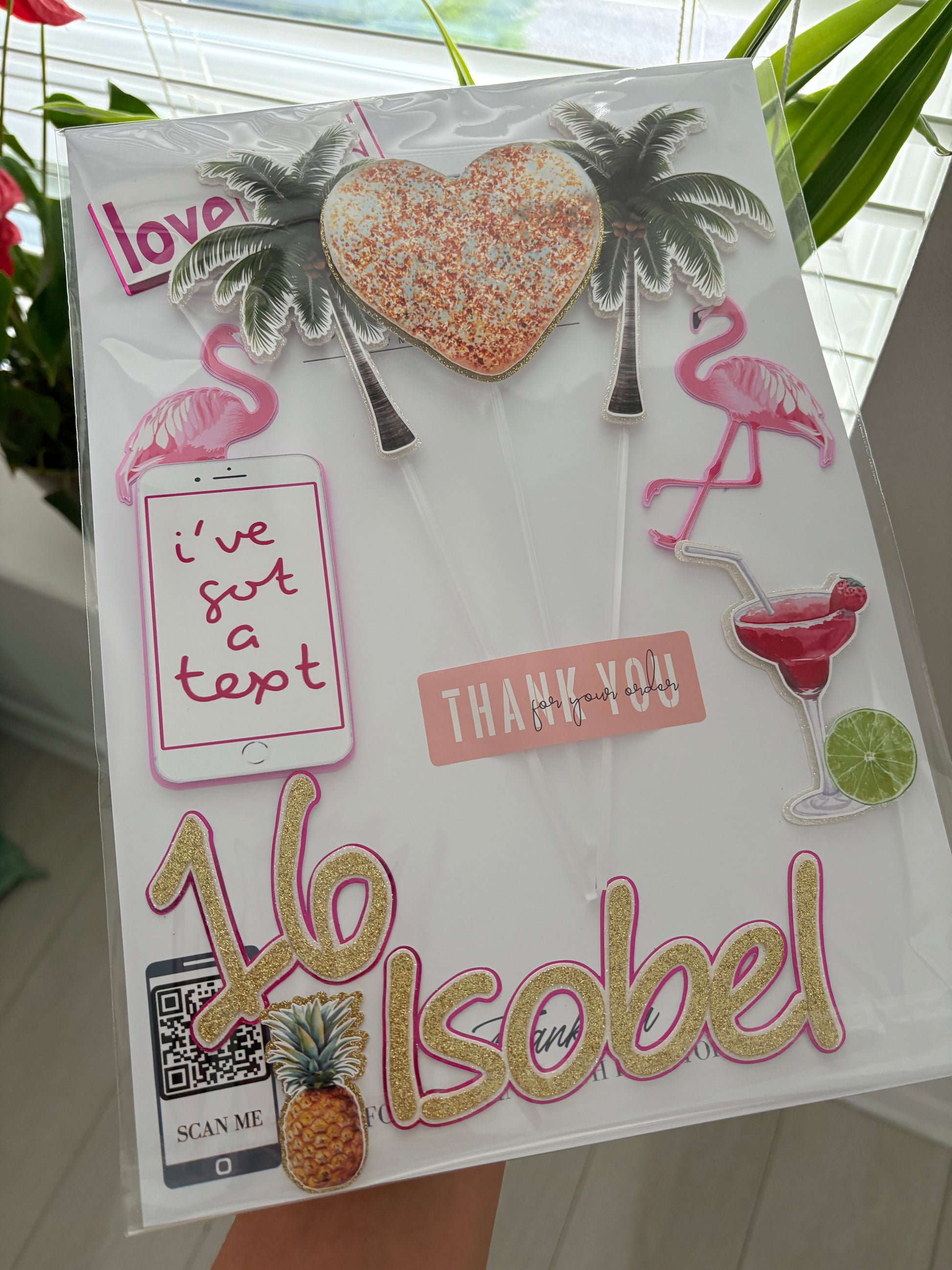 Love Island cake topper set featuring palm trees, flamingos, phone, heart, and personalised name and age charms, layered for added detail