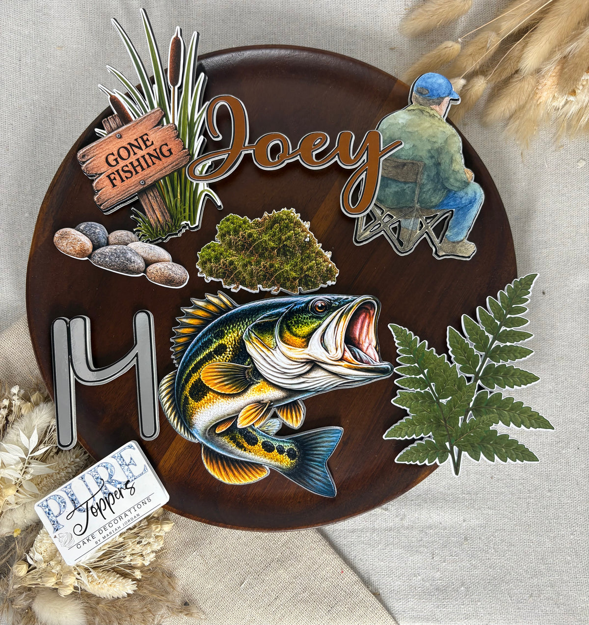 Detailed bass fish cake topper decoration for a personalised fishing-themed birthday cake