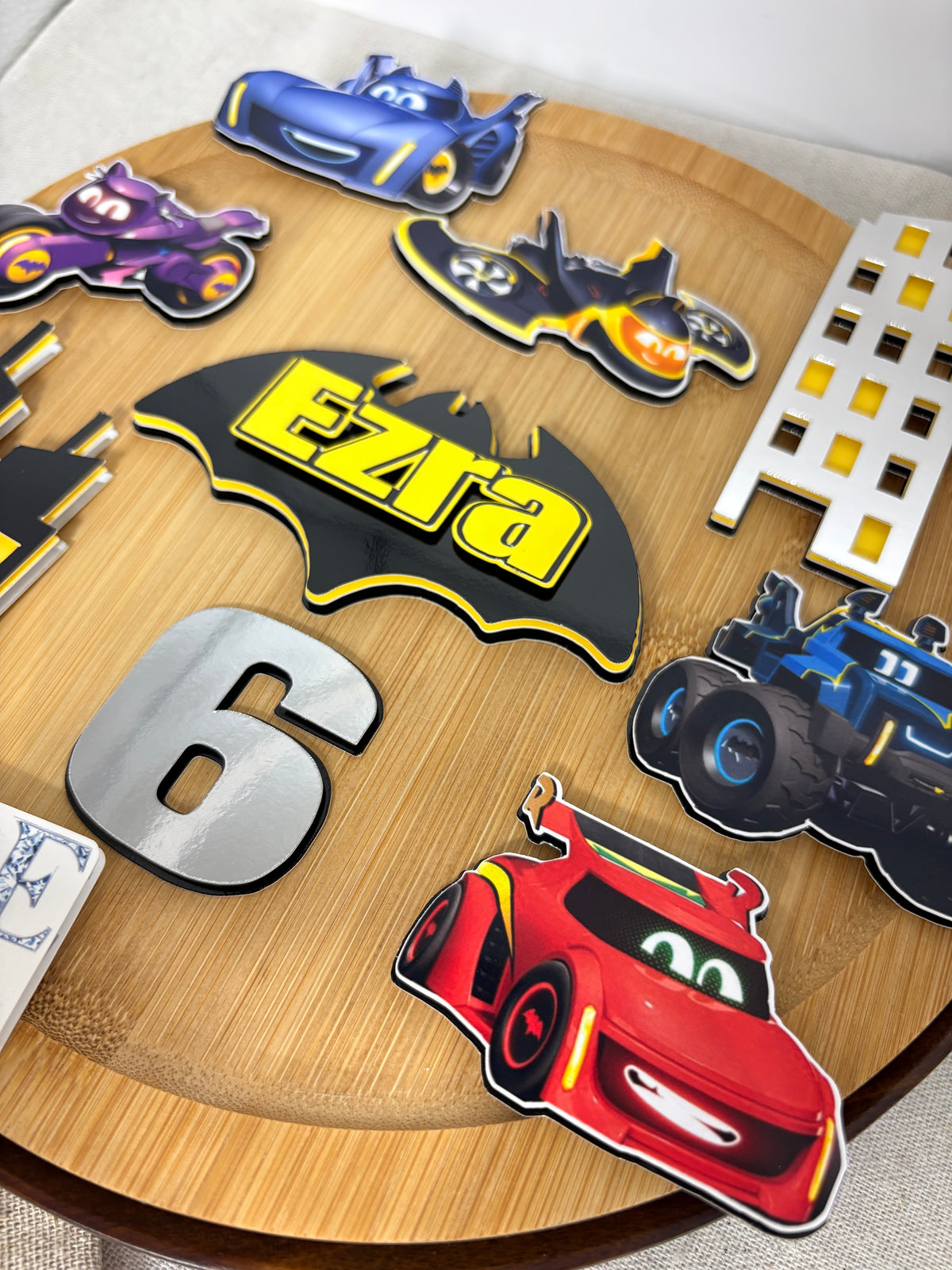 Batwheels birthday cake decorations with colourful character vehicles