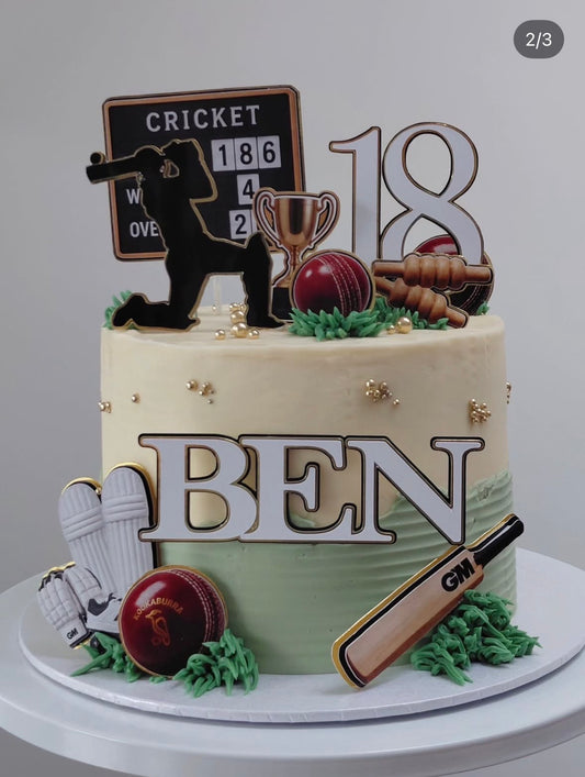 Personalised triple-layered cricket birthday age topper attached to a cake topper stick