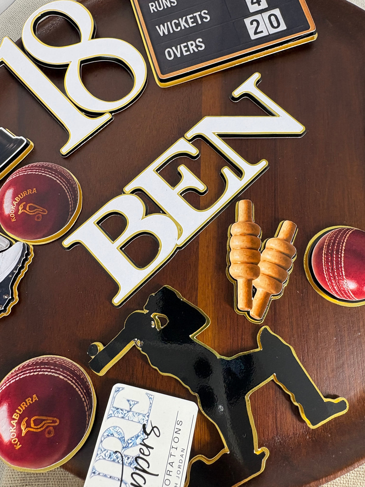 Cricket trophy cup and cricket bails decorations for a personalised cricket birthday cake