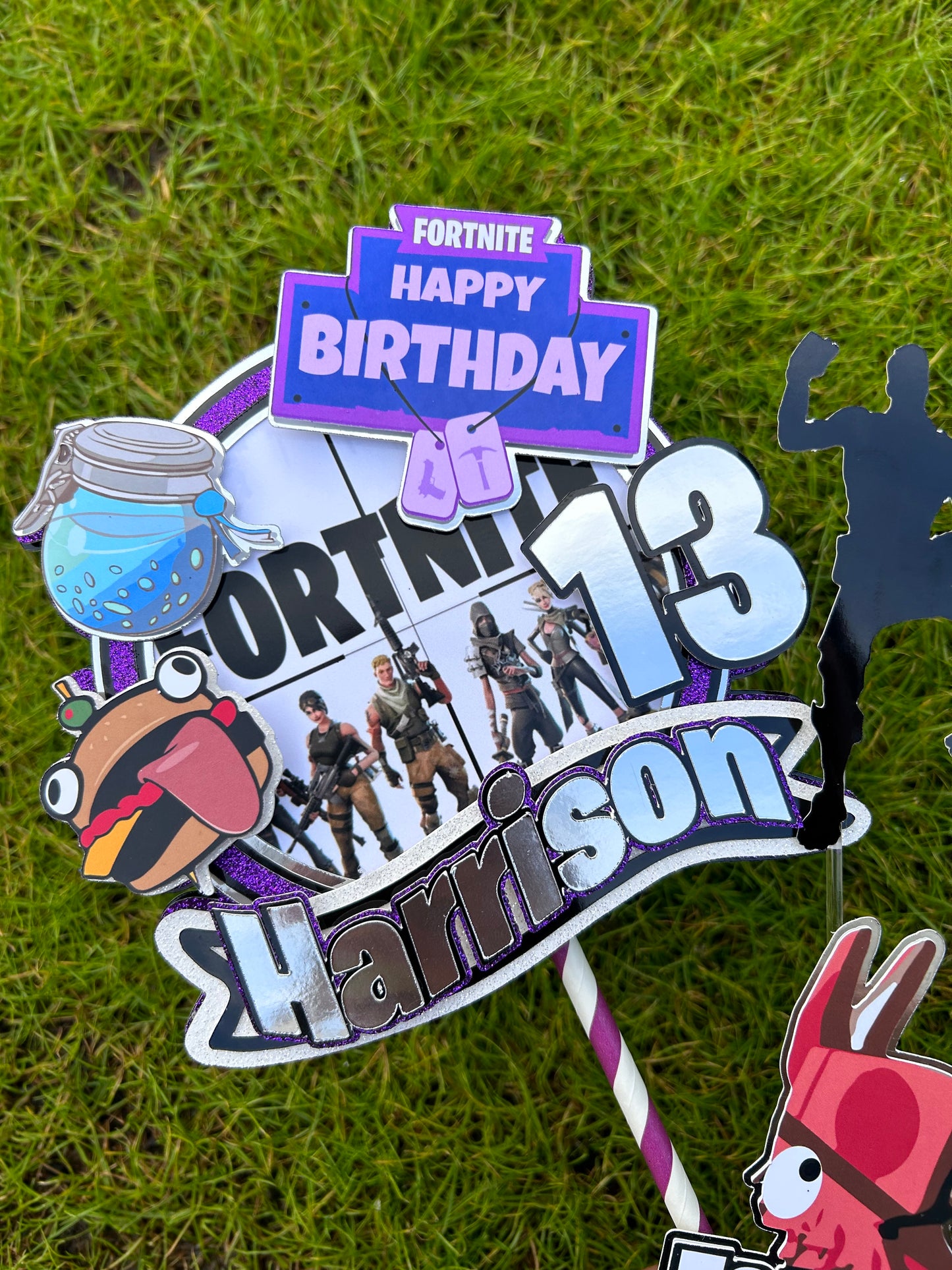 Fortnite inspired gaming cake decorations with character and badge cake charms