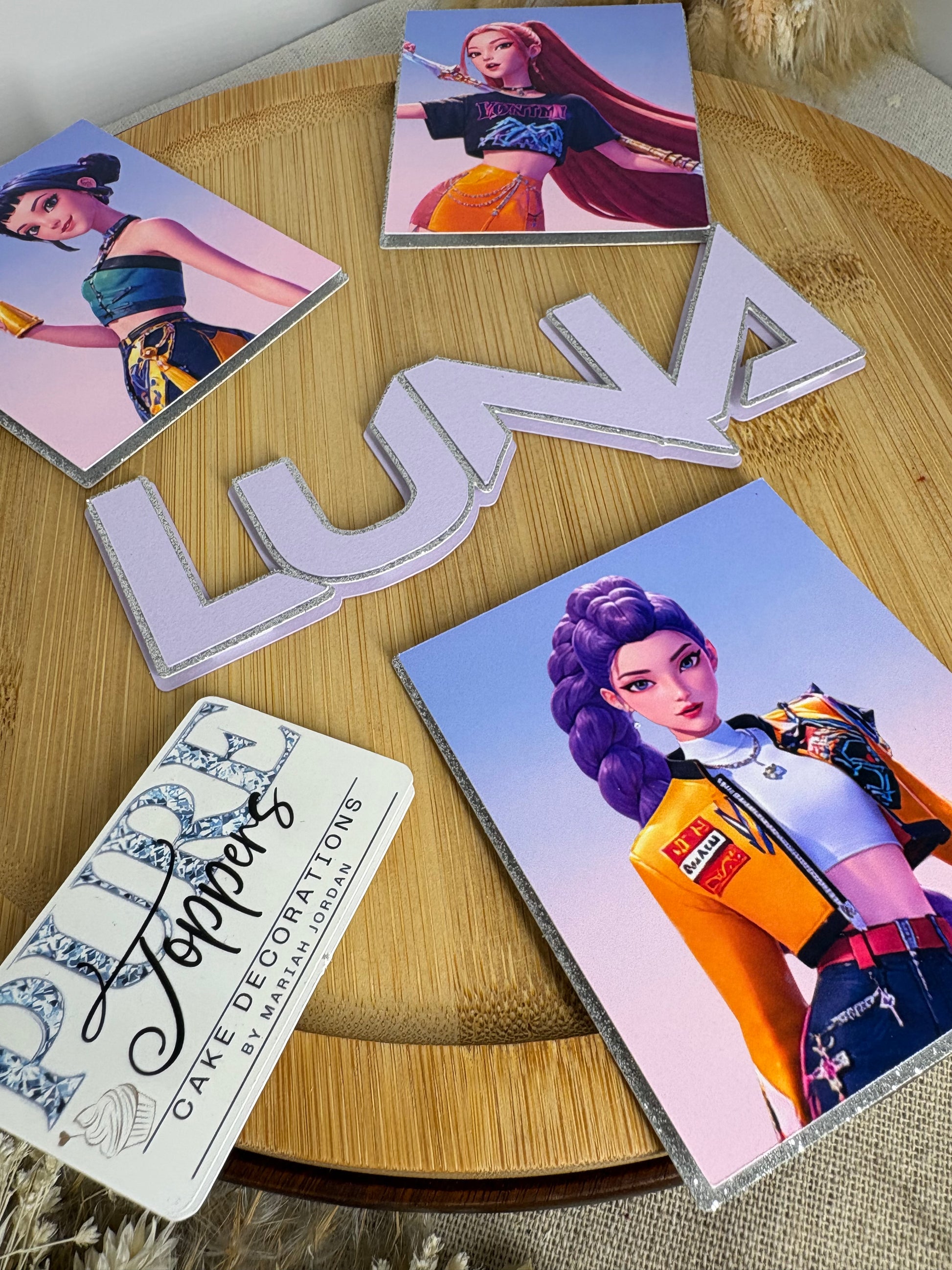 KPop Demon Hunters cake charms with three framed characters and personalised name
