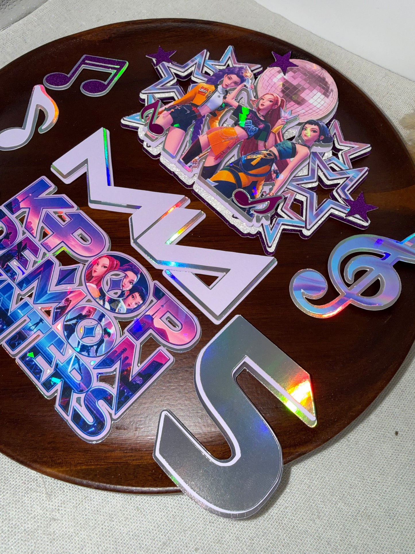KPop Demon Hunters character cake charms with holographic film finish