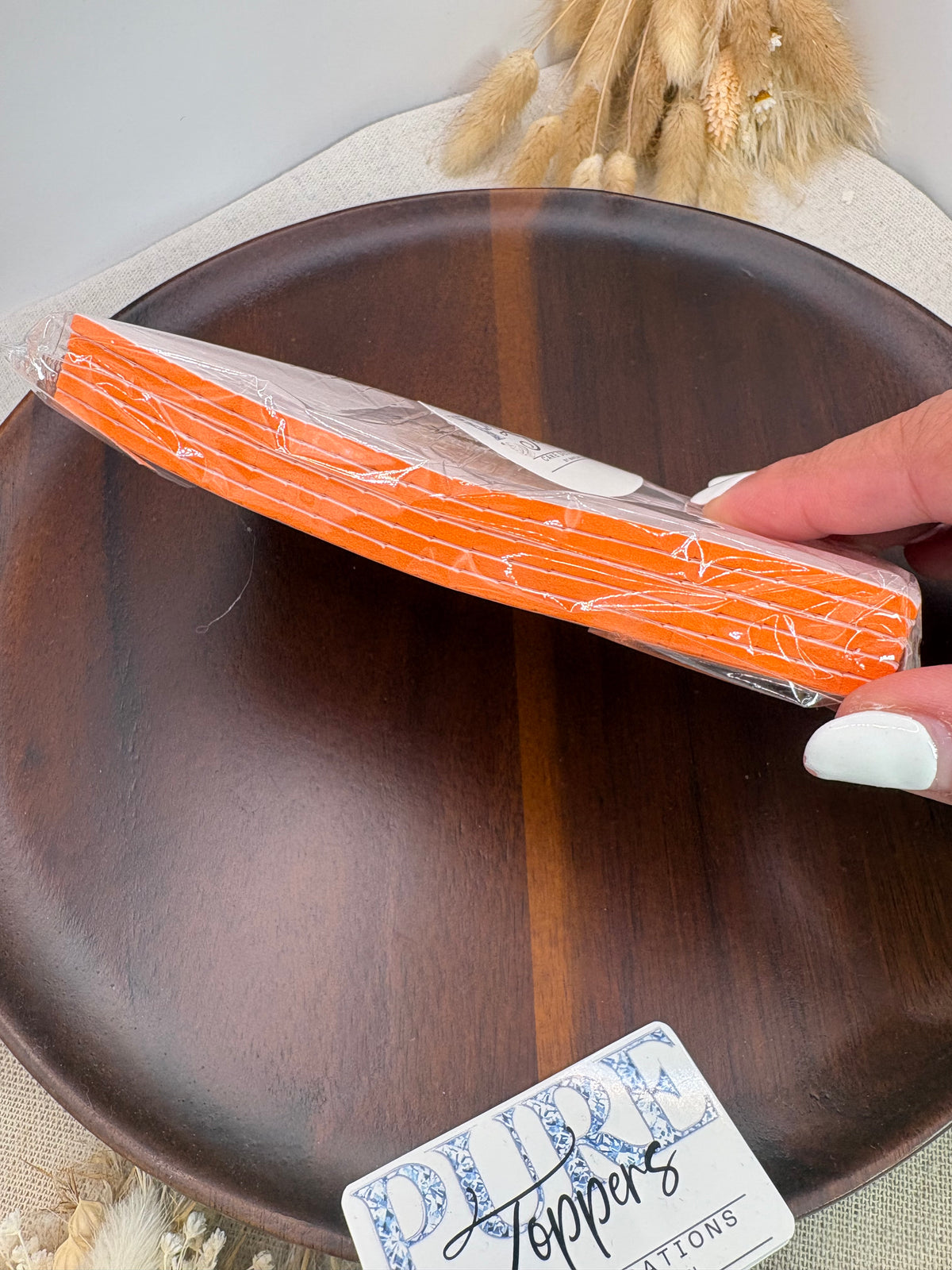 Orange pre-cut 3mm double sided adhesive foam pads for cake toppers, card making and craft projects.