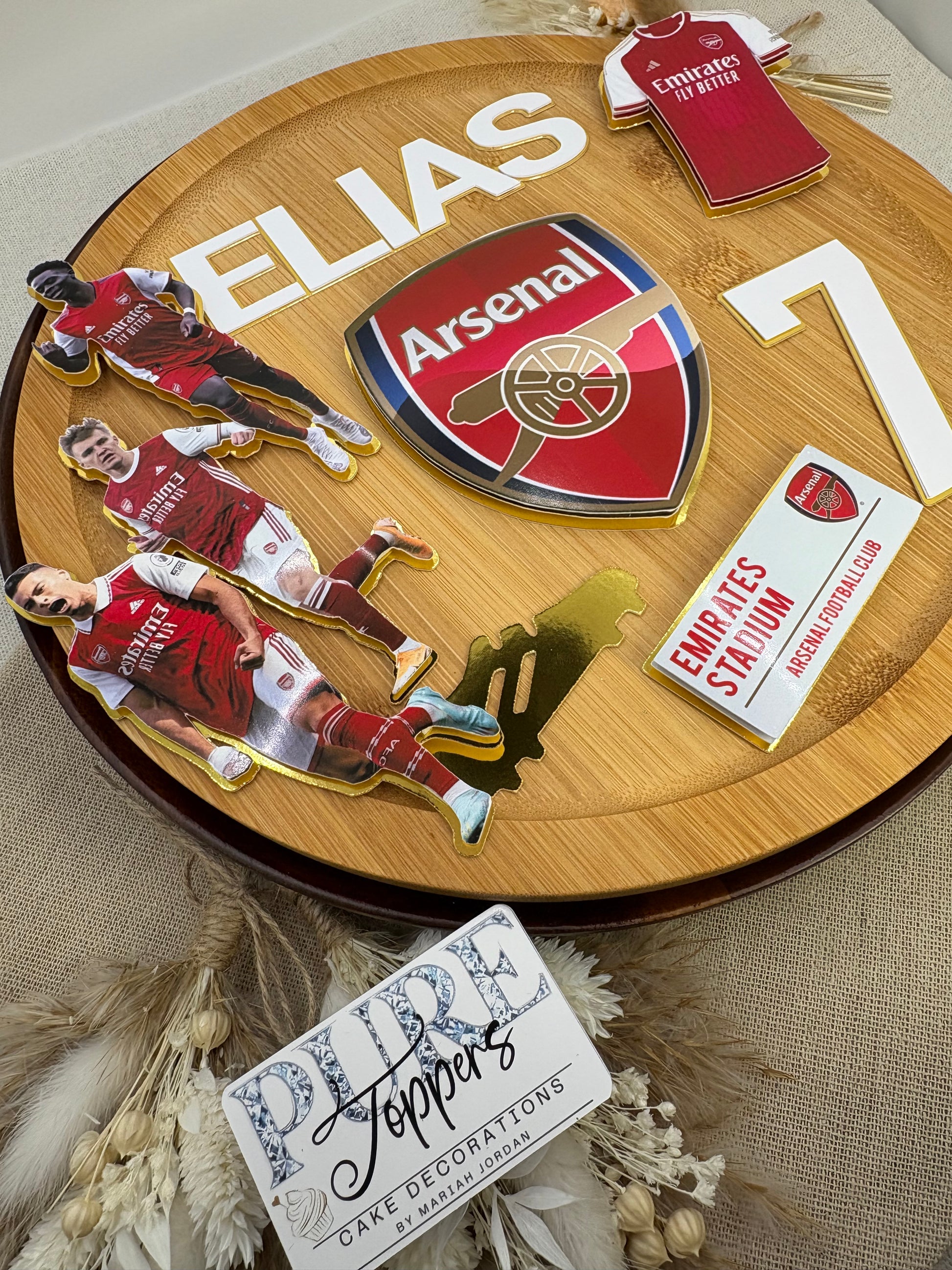 Personalised Arsenal football cake topper with custom name and age on birthday cake