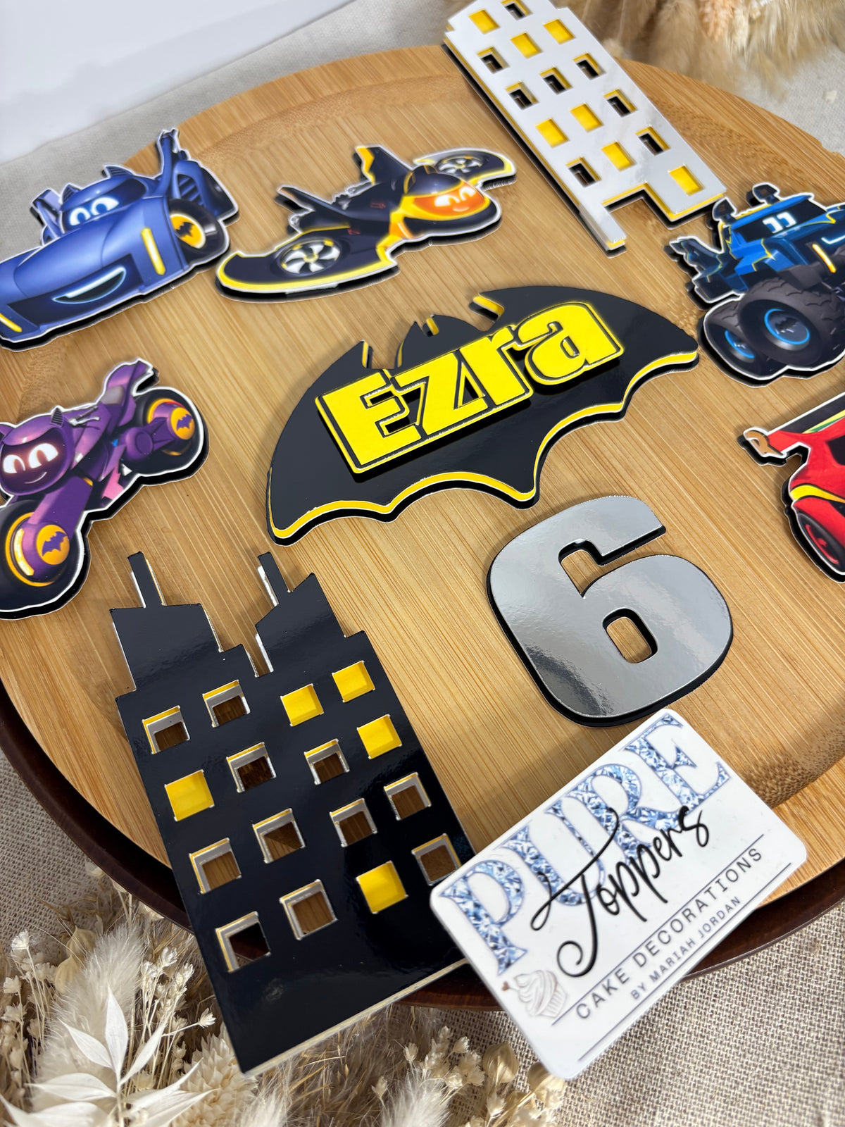 Personalised Batwheels cake decorations with vehicles and Gotham City buildings