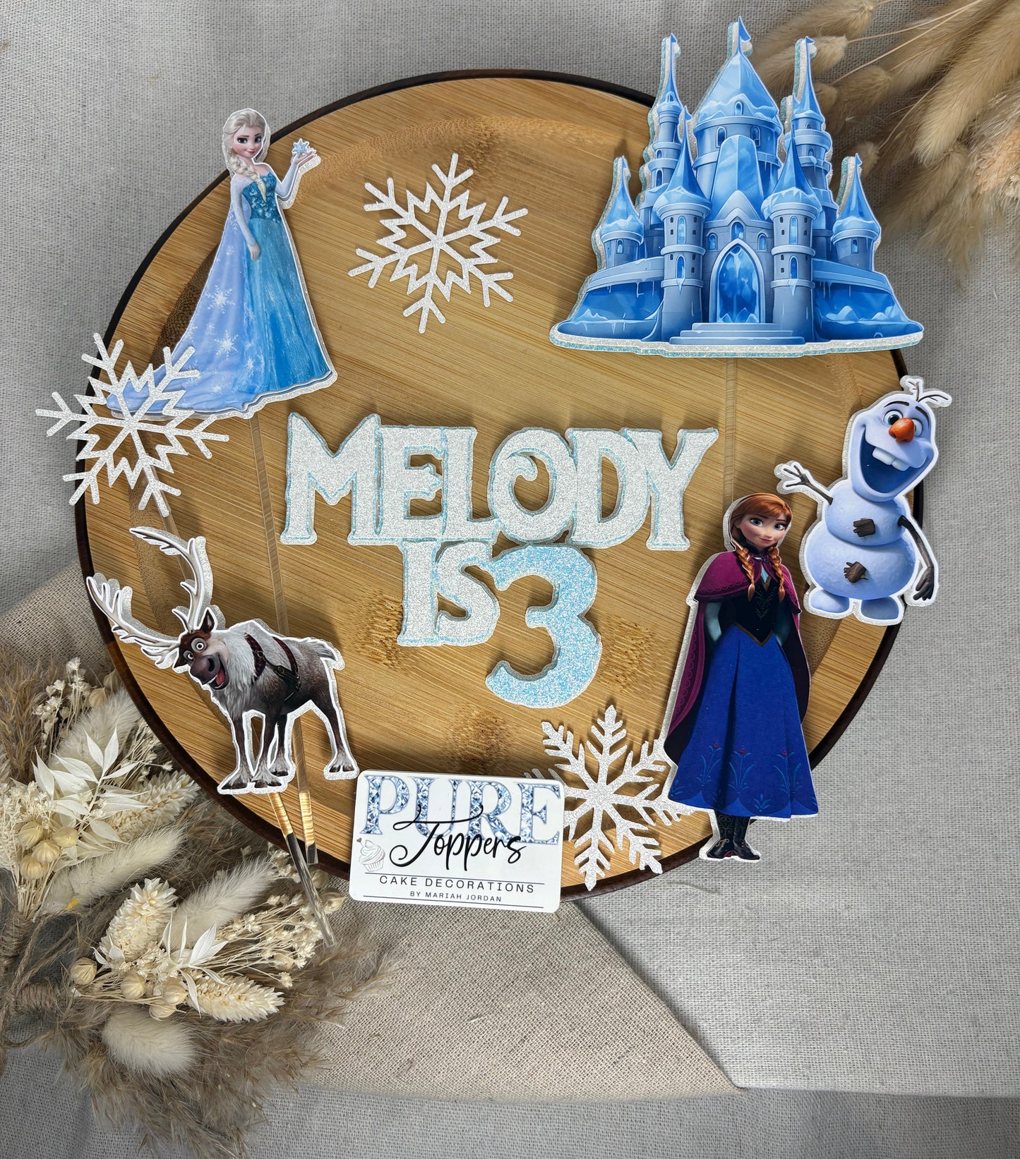 Personalised Frozen inspired cake topper set with ice princess characters, name, age, castle and winter decorations