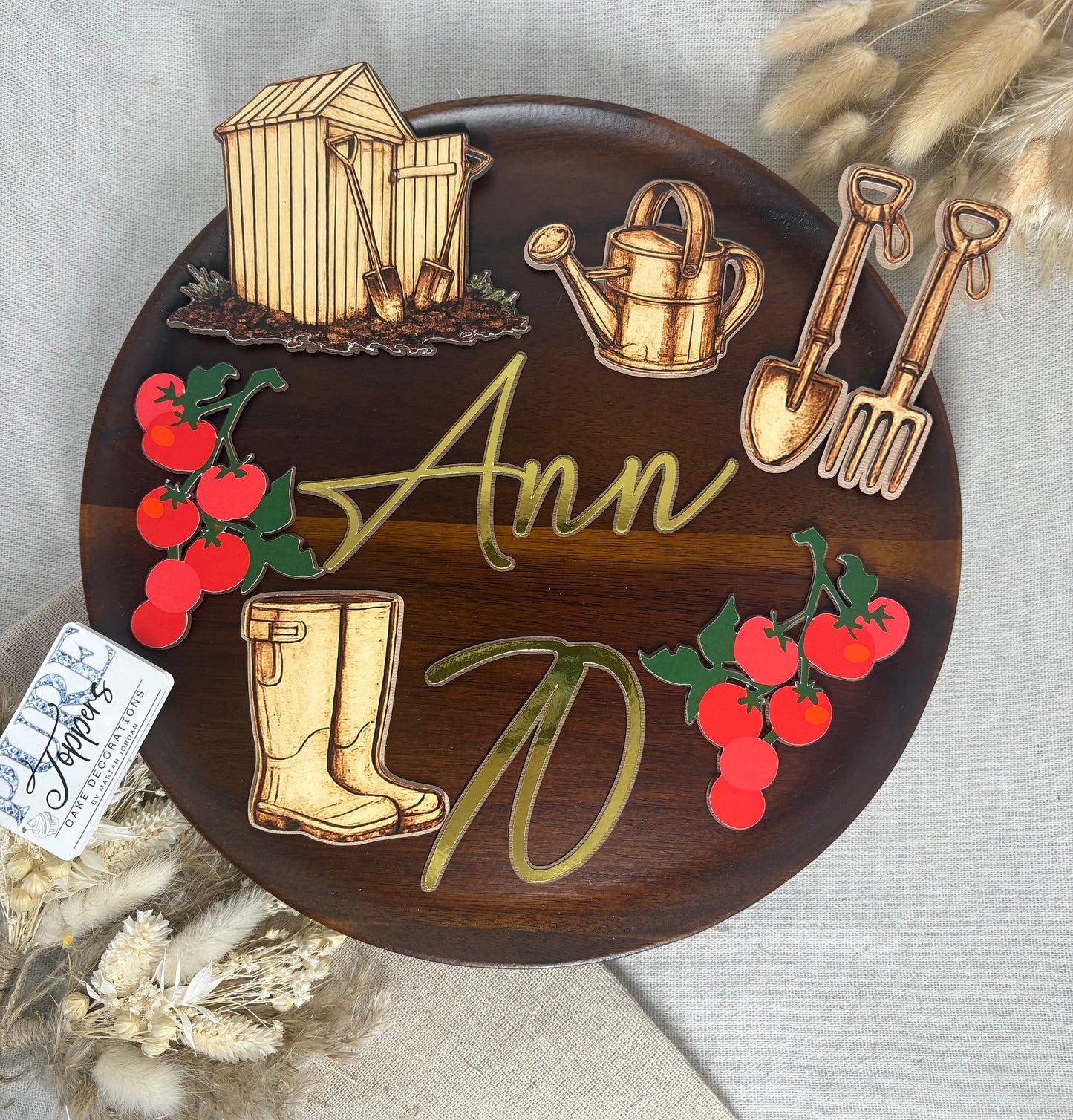Layered gardening cake topper featuring personalised name and age with allotment-themed birthday cake decorations.