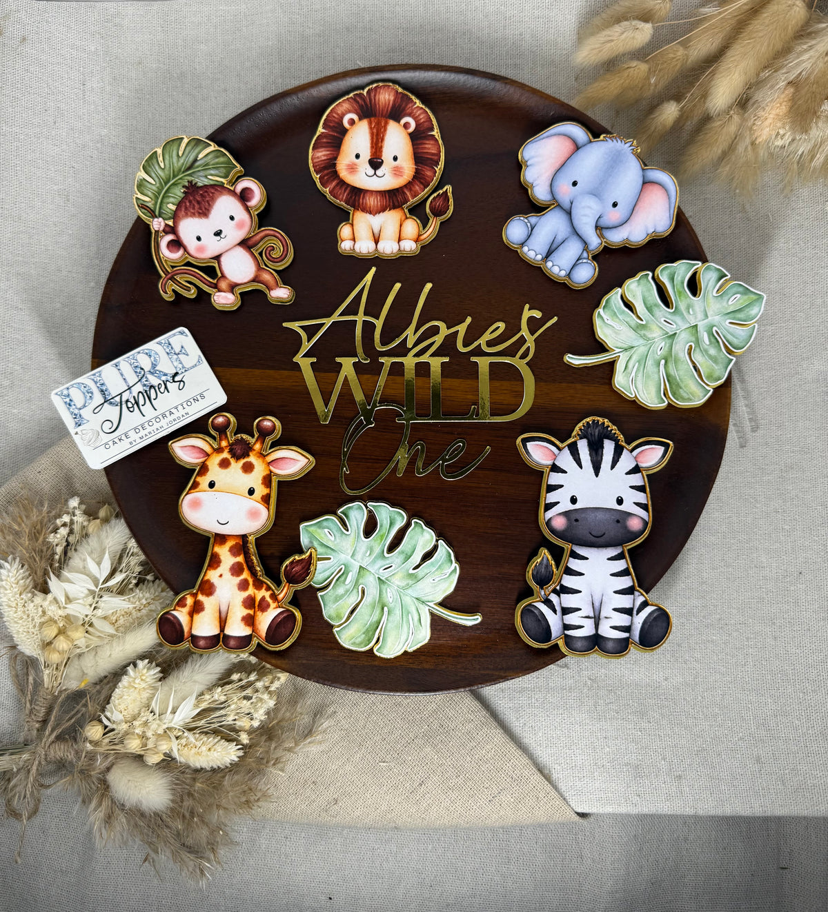 Personalised Wild One safari cake topper set with lion, elephant, giraffe, zebra, monkey and jungle leaves