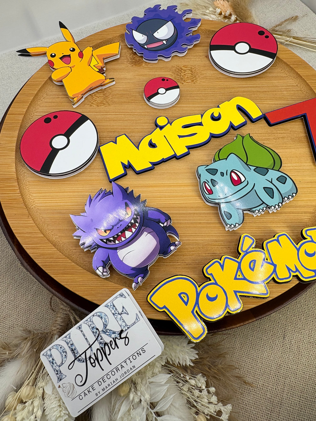 Personalised Pokémon themed birthday cake topper and decorations