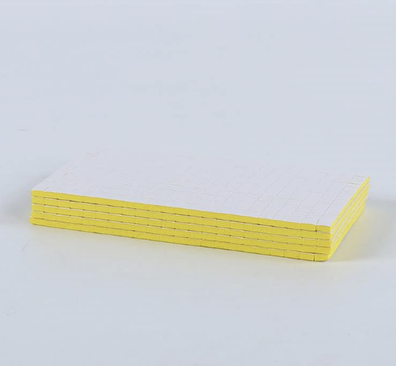 Pre-cut adhesive foam square sheet containing approximately 264 double sided foam pads